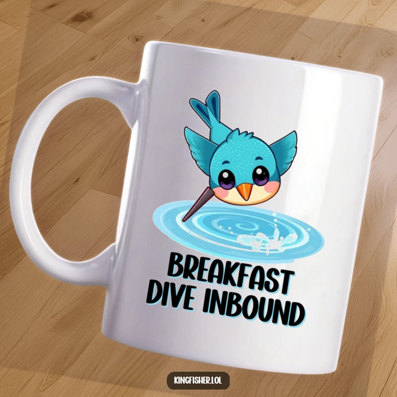 Funny mug showing a cheerful kingfisher with large eyes, diving headfirst with excitement towards a sparkling water surface.