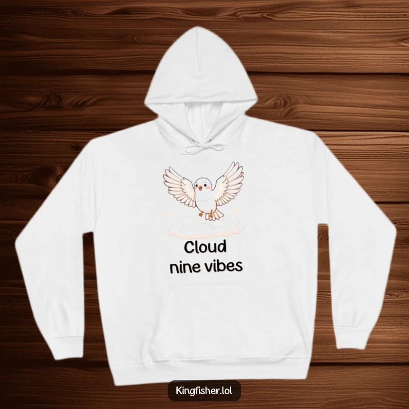 Funny Joyful Bird Hoodie: A bird with wings spread wide glides joyfully through fluffy clouds. Cozy and funny clothing.