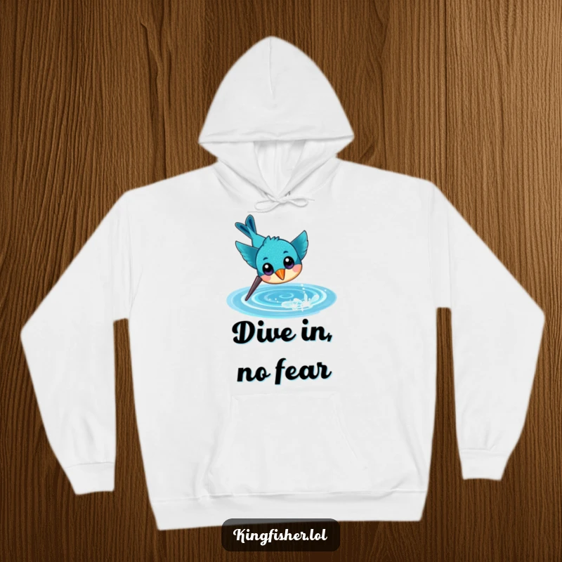 Funny hoodie depicting a cheerful kingfisher with large eyes, diving headfirst with enthusiasm towards a sparkling water surface.