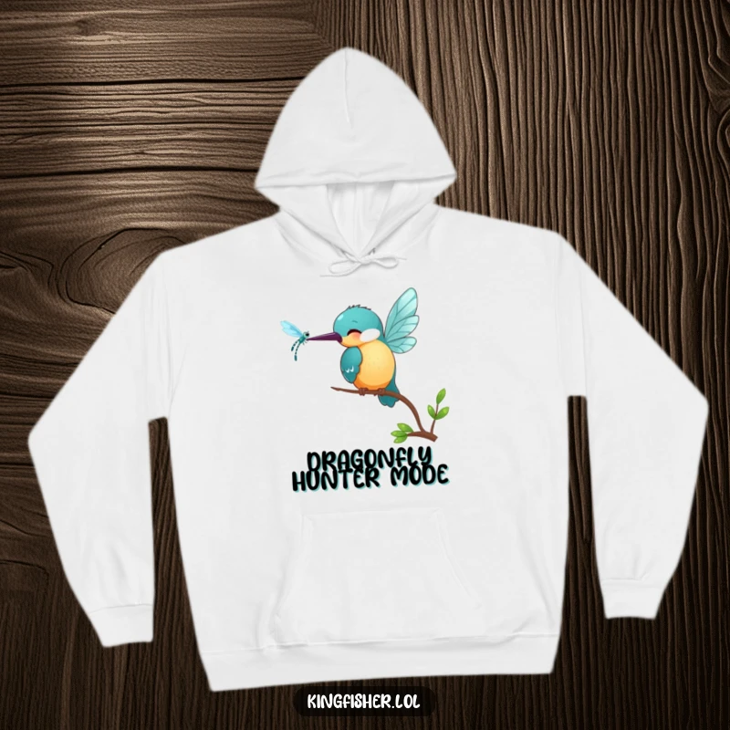 Funny Kingfisher Hoodie: A smiling kingfisher bird playfully pecks at a shimmering dragonfly, offering warm, humorous comfort.