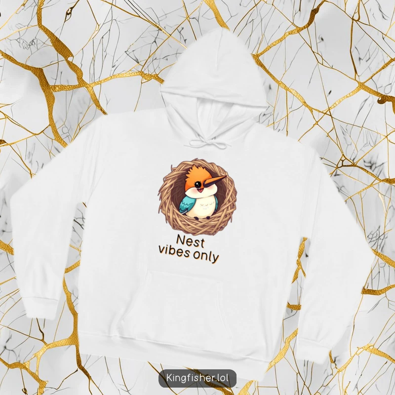 Funny Kingfisher Hoodie: A curious bird with a grin peeking from a woven nest, offering cozy charm.