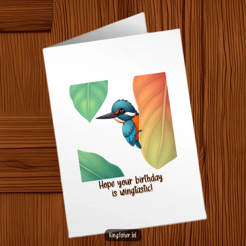 Funny Free Printable Birthday Card: A cheerful kingfisher peeks curiously from behind a large, vibrant leaf.