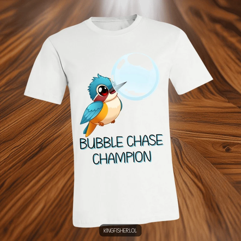 Funny kingfisher t-shirt, a bird with wide eyes comically chasing a giant bubble, capturing playful, silly energy.