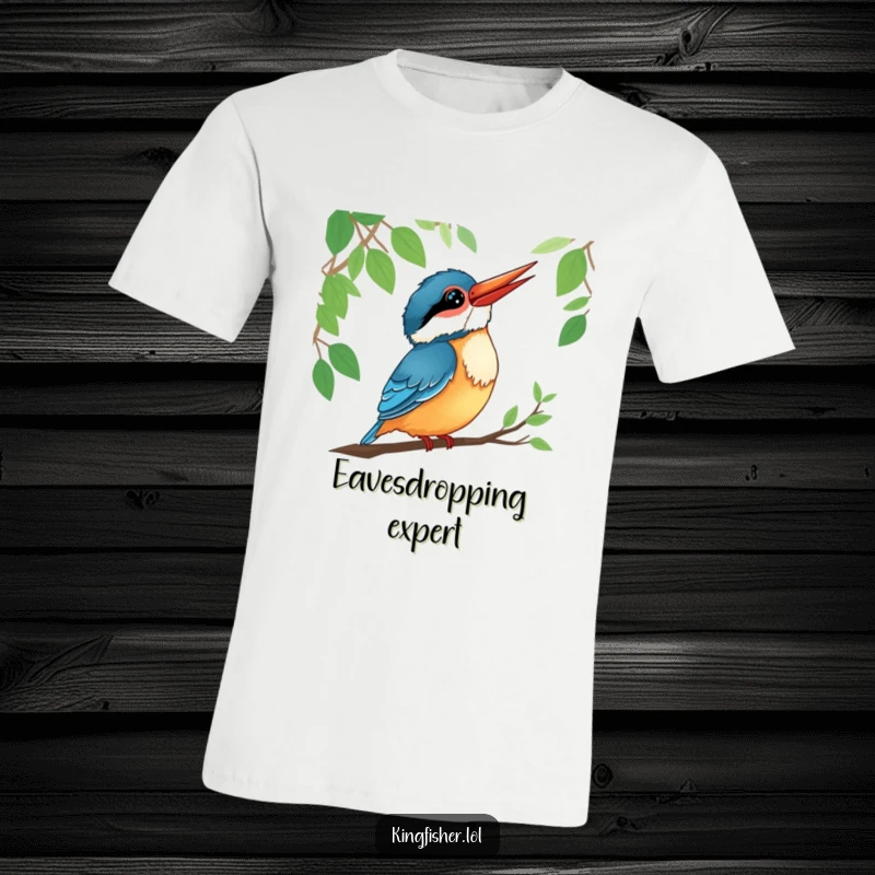 Funny kingfisher character t-shirt, tilting head with a smile, listening intently to forest sounds.