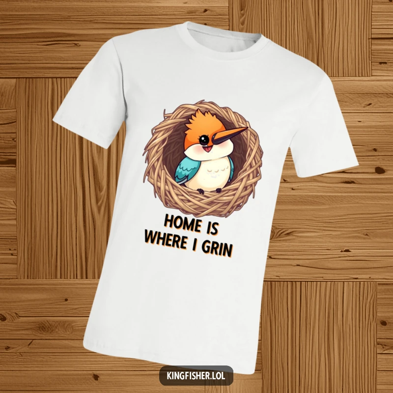 Funny Kingfisher T-Shirt: A curious bird with a grin peeking out from a woven nest, exuding charm.