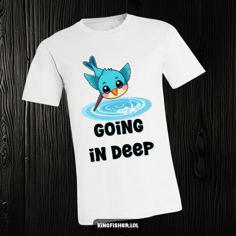 Funny t-shirt featuring a cheerful kingfisher with large eyes, captured mid-dive towards a shimmering, sparkling water surface.