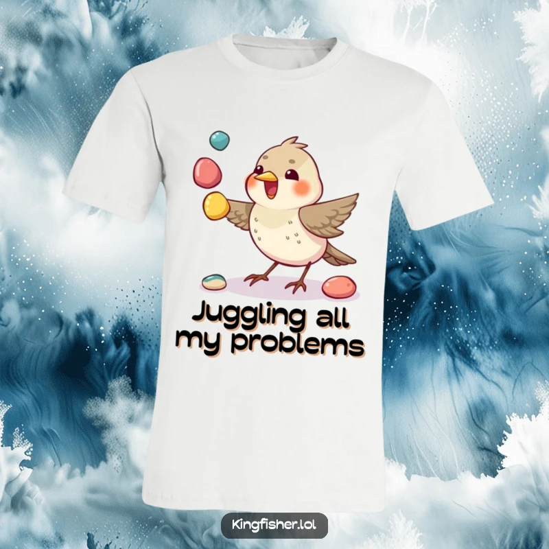 Funny Juggling Bird T-Shirt: A small bird comically juggles colorful pebbles using its beak, demonstrating talent.