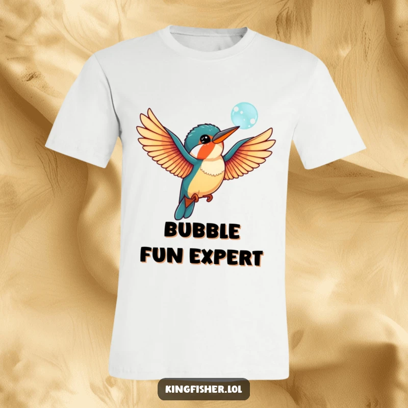 Funny kingfisher bird t-shirt showing outstretched wings, playfully interacting with a floating bubble, conveying a sense of lighthearted adventure.