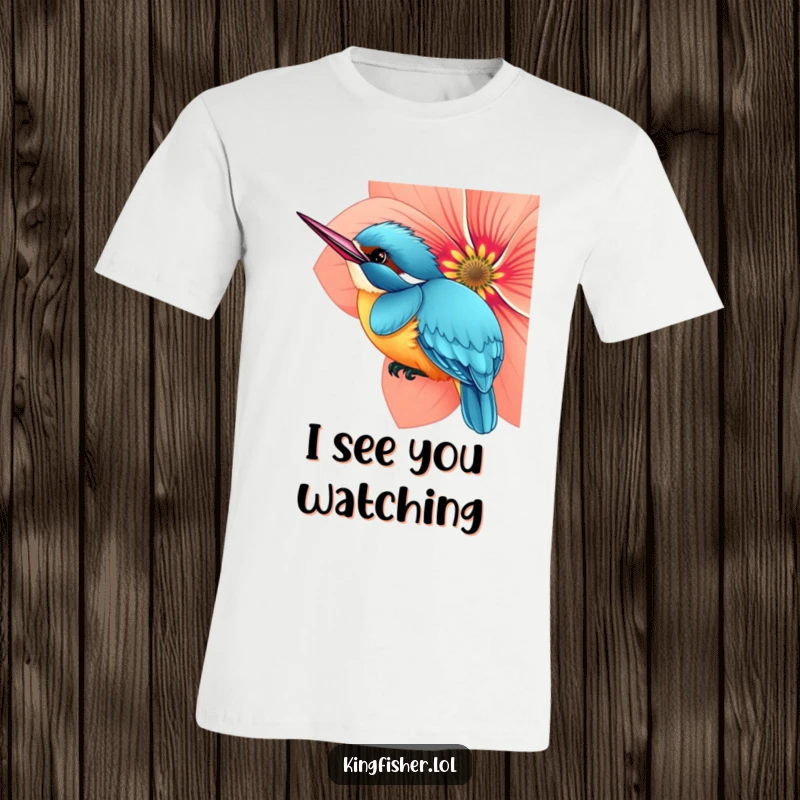 Funny t-shirt featuring a curious kingfisher bird peeking slyly from behind an oversized, colorful flower, hinting at discovery.