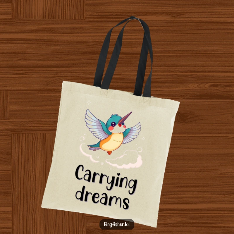 Funny Kingfisher Tote Bag: A cheerful kingfisher bird with flapping wings soars joyfully through a wispy cloud.